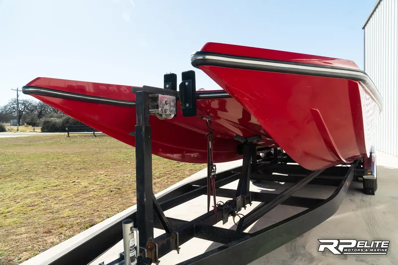 Slide: The Image of Red 1998 Warlock 28 SXT boat on trailer, side view. - 30