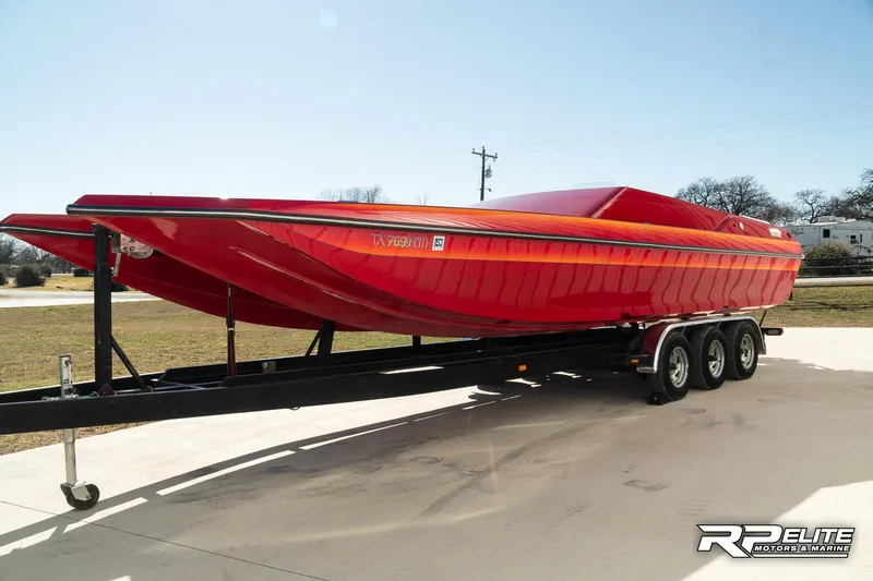 Slide: The Image of Red 1998 Warlock 28 SXT powerboat on trailer, side view. - 5