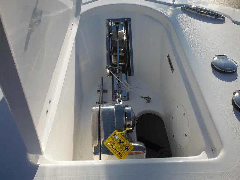 Slide: The Image of Anchor compartment of 2025 Tidewater 232 LXF boat, featuring a winch system. - 12