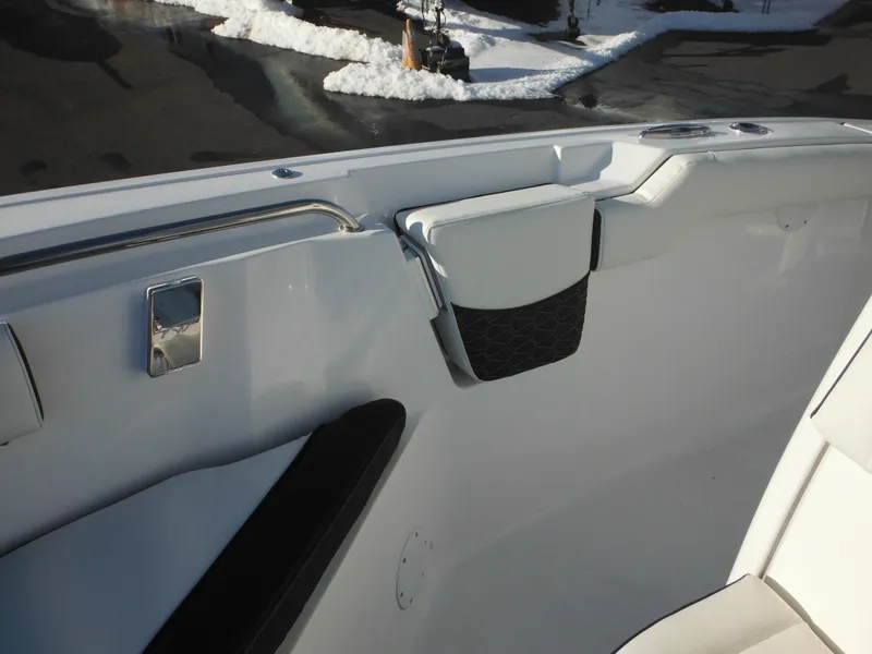 Slide: The Image of 2025 Tidewater 232 LXF boat interior, featuring sleek white seating and modern design elements. - 16