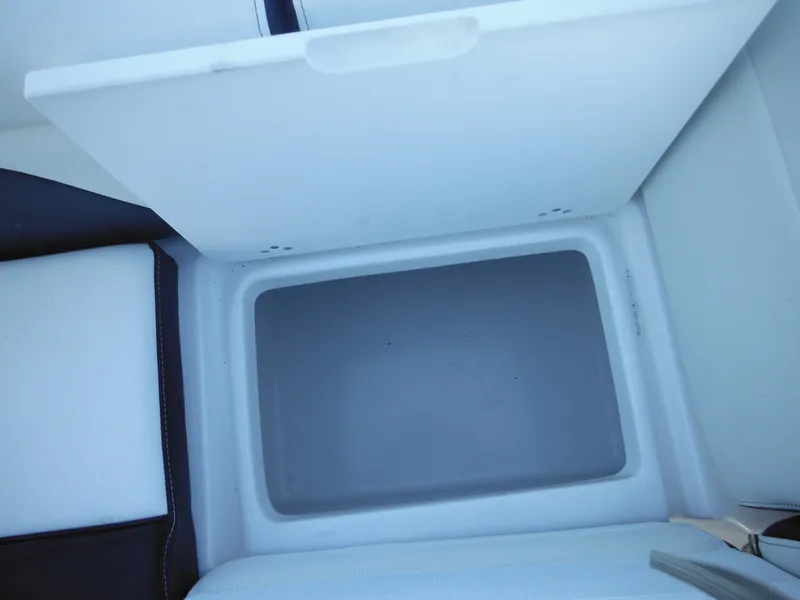 Slide: The Image of Open storage compartment on 2025 Tidewater 232 LXF boat. - 37