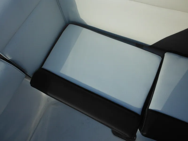 Slide: The Image of 2025 Tidewater 232 LXF boat seat with black and white upholstery. - 38