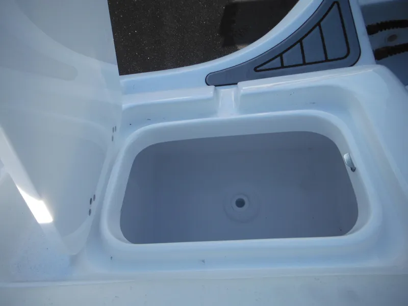 Slide: The Image of Open storage compartment on a 2025 Tidewater 232 LXF boat. - 41