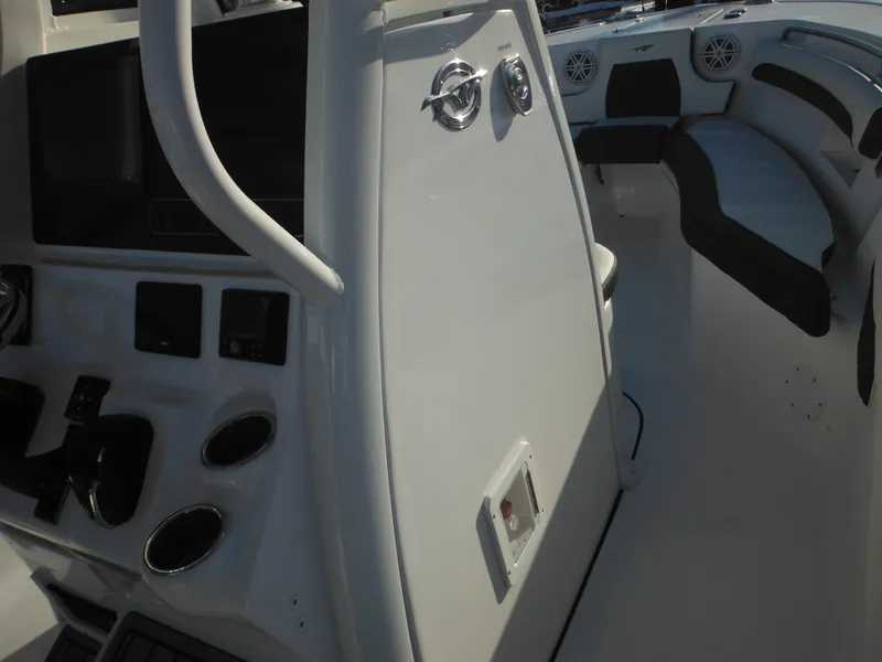 Slide: The Image of 2025 Tidewater 232 LXF boat interior with modern console and seating. - 43