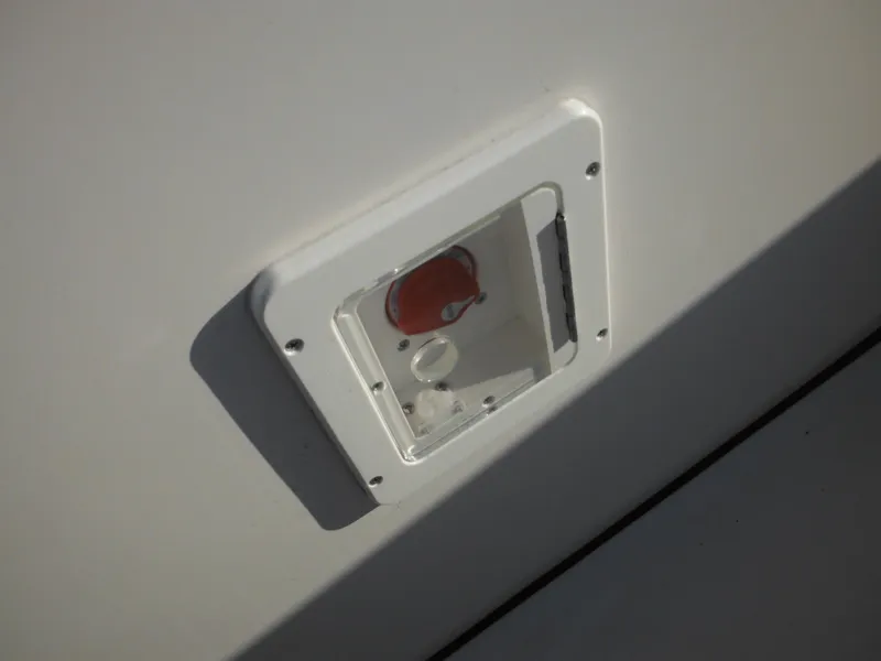 Slide: The Image of 2025 Tidewater 232 LXF boat detail, featuring a white access panel on the exterior. - 44