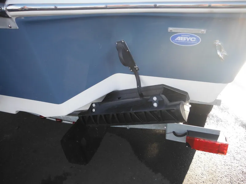 Slide: The Image of 2025 Tidewater 232 LXF boat rear view with trim tab and trailer. - 8