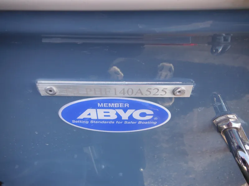 Slide: The Image of 2025 Tidewater 232 LXF boat with ABYC member sticker and serial number plate. - 9