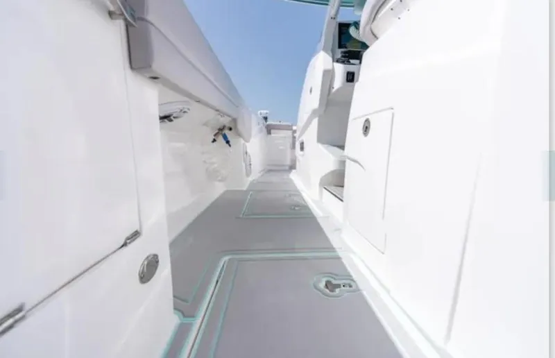 Slide: The Image of 2023 Intrepid 375 boat interior with sleek white design and modern features. - 13