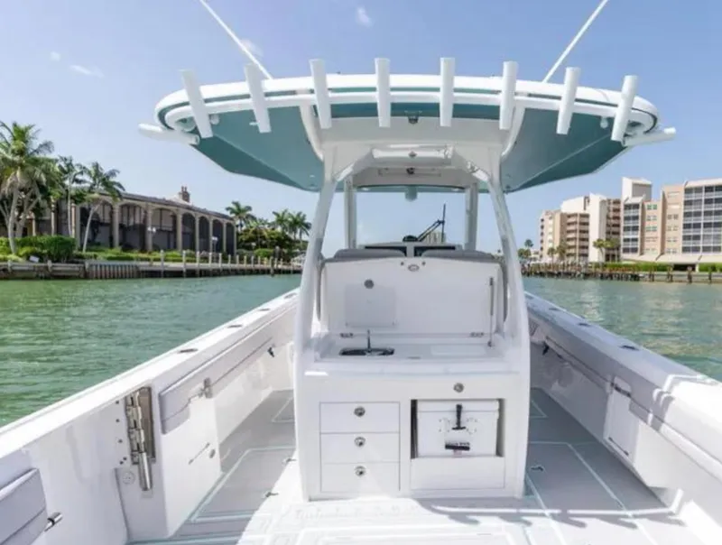 Slide: The Image of 2023 Intrepid 375 boat on water, featuring sleek design and spacious deck. - 4