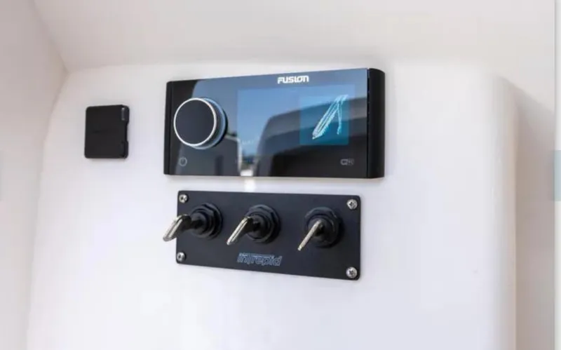Slide: The Image of Control panel of a 2023 Intrepid 375 boat with Fusion audio system. - 8