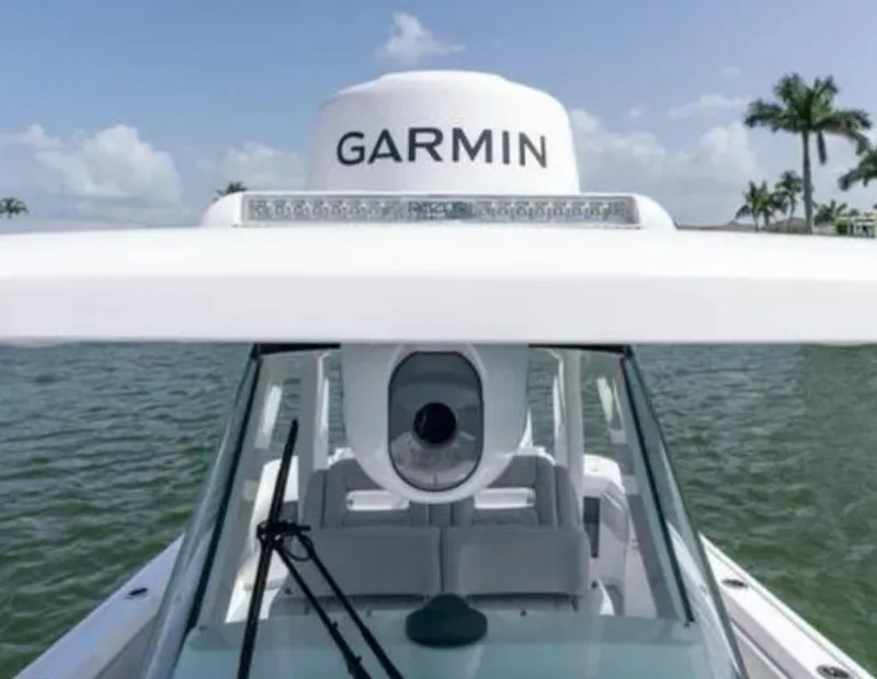 Slide: The Image of 2023 Intrepid 375 boat with Garmin radar, on a sunny day by the water. - 9