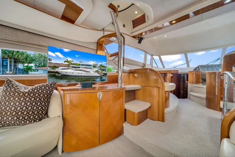Slide: The Image of Luxurious interior of a 2002 Princess 61 yacht with elegant wood finishes and modern amenities. - 30