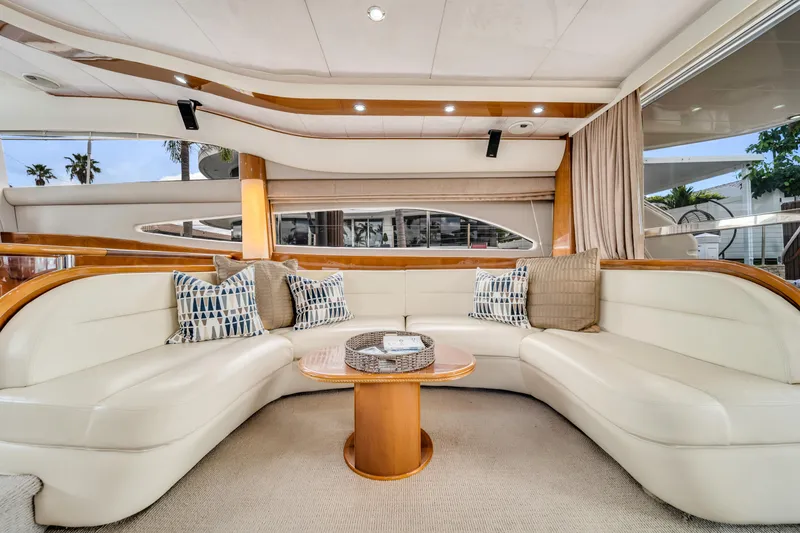 Slide: The Image of Luxurious interior of a 2002 Princess 61 yacht with elegant seating and decor. - 31