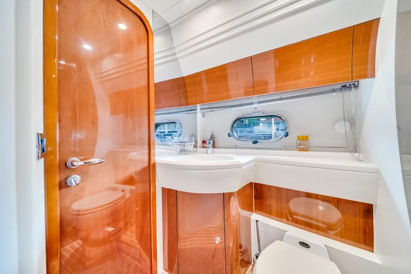 Slide: The Image of Luxurious bathroom interior of 2002 Princess 61 yacht with wooden finishes and modern fixtures. - 39