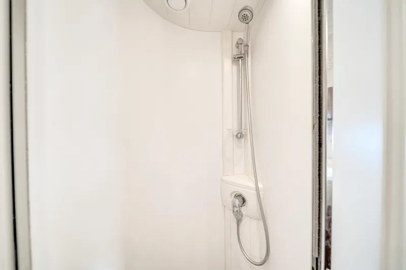 Slide: The Image of White shower area in a 2002 Princess 61 yacht bathroom. - 41