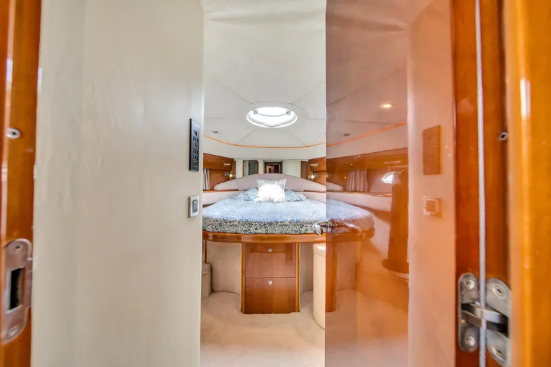 Slide: The Image of Luxurious cabin interior of 2002 Princess 61 yacht with elegant wood finishes. - 42