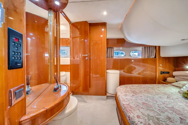 Slide: The Image of Luxurious cabin interior of 2002 Princess 61 yacht with wood finishes and elegant decor. - 44