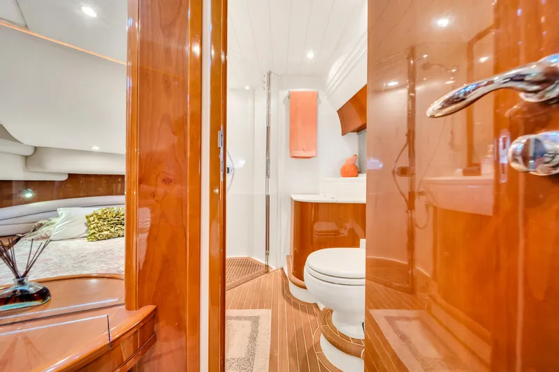 Slide: The Image of Luxurious bathroom interior on a 2002 Princess 61 yacht, featuring wood finishes and modern amenities. - 45