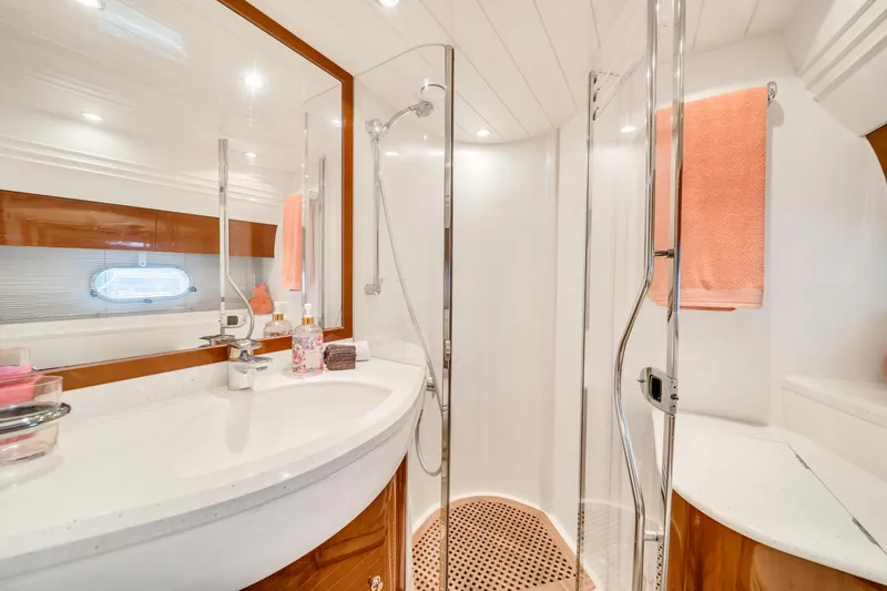 Slide: The Image of Luxurious bathroom in 2002 Princess 61 yacht with modern fixtures and elegant design. - 46