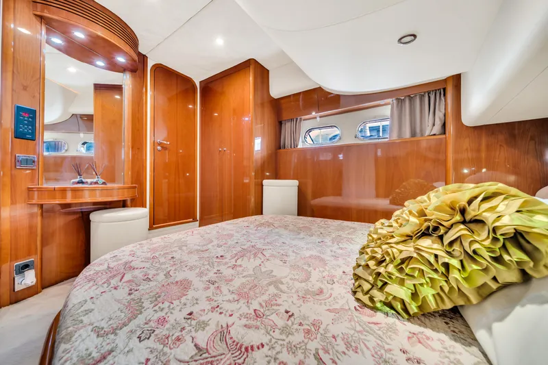 Slide: The Image of Luxurious cabin interior of 2002 Princess 61 yacht with elegant wood finish. - 48