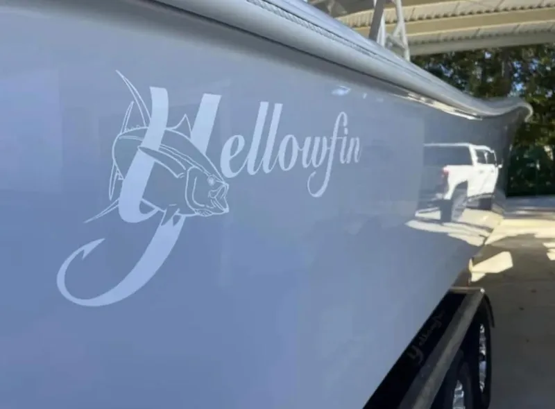 Slide: The Image of 2024 Yellowfin 36 Offshore boat with logo detail in a covered area. - 10