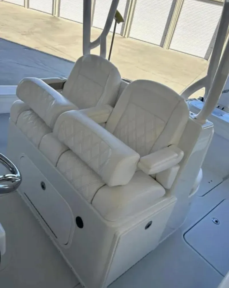 Slide: The Image of 2024 Yellowfin 36 Offshore boat seating with white cushioned seats and armrests. - 4