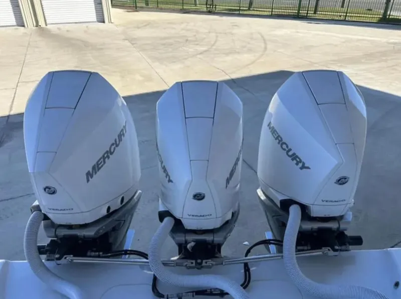 Slide: The Image of Triple Mercury outboard engines on a 2024 Yellowfin 36 Offshore boat. - 5