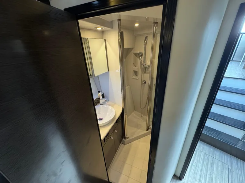 Slide: The Image of Bathroom interior of 2017 Cruisers Yachts 45 Cantius, featuring modern fixtures and sleek design. - 17
