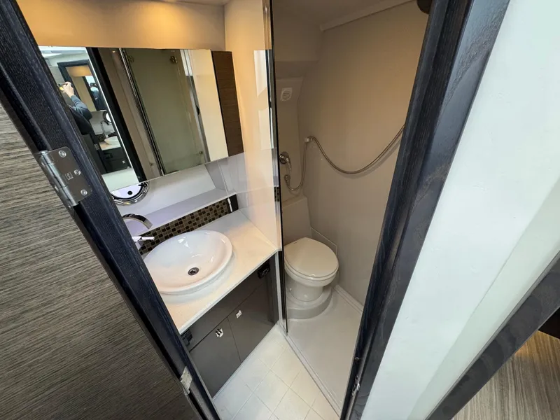 Slide: The Image of Luxurious bathroom in 2017 Cruisers Yachts 45 Cantius, featuring modern sink and toilet. - 20