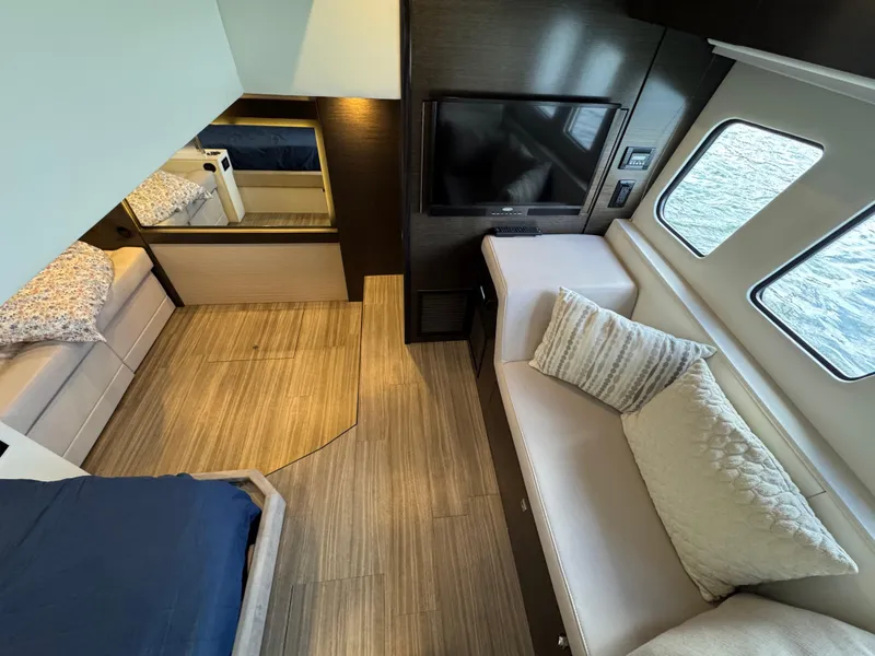 Slide: The Image of Interior of 2017 Cruisers Yachts 45 Cantius with modern furnishings and large windows. - 21