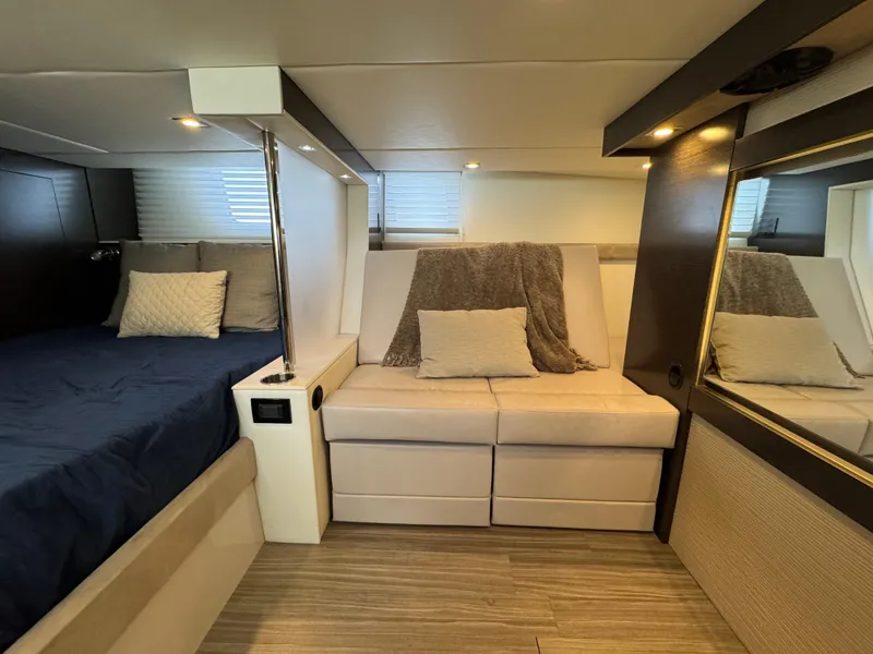 Slide: The Image of 2017 Cruisers Yachts 45 Cantius interior cabin with bed, sofa, and modern decor. - 23