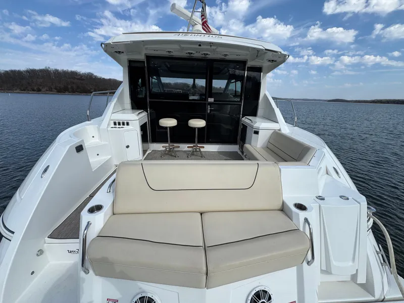 Slide: The Image of 2017 Cruisers Yachts 45 Cantius on water, featuring spacious seating and modern design. - 4