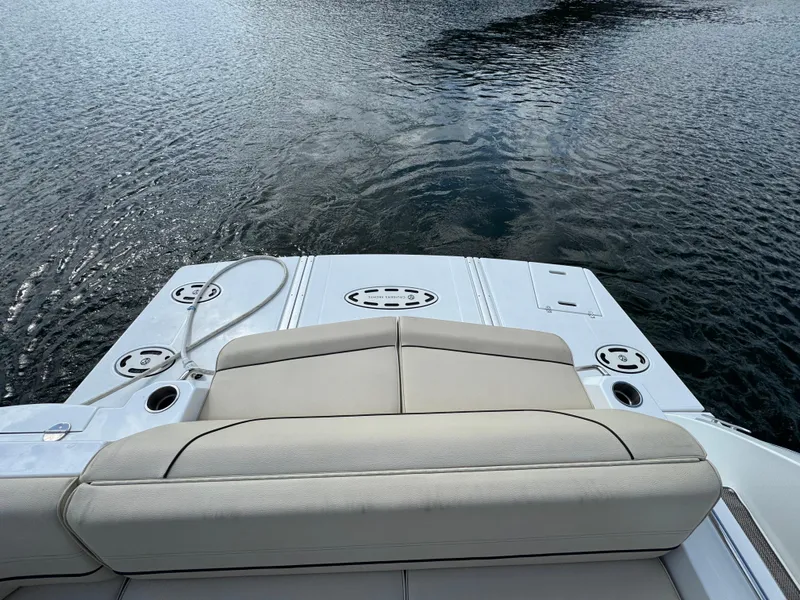 Slide: The Image of 2017 Cruisers Yachts 45 Cantius swim platform with seating, overlooking calm water. - 5
