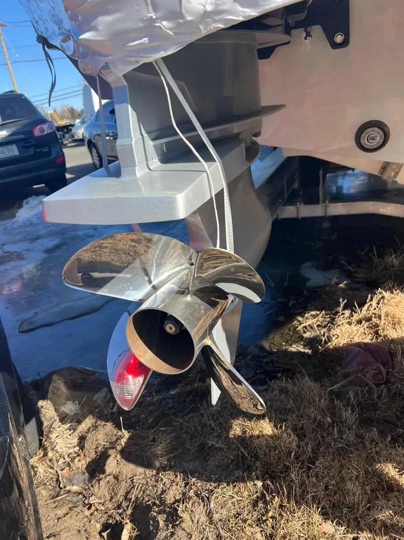 Slide: The Image of Close-up of a 2025 Fountain 38 SCX boat propeller on dry land. - 16
