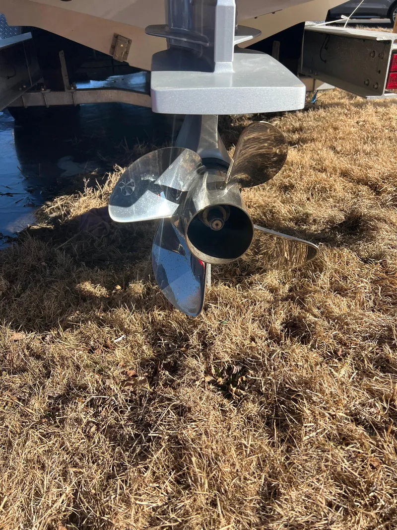 Slide: The Image of Propeller of 2025 Fountain 38 SCX boat on dry grass. - 17