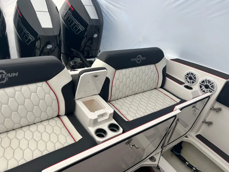 Slide: The Image of 2025 Fountain 38 SCX boat interior with stylish seating and powerful engines. - 27