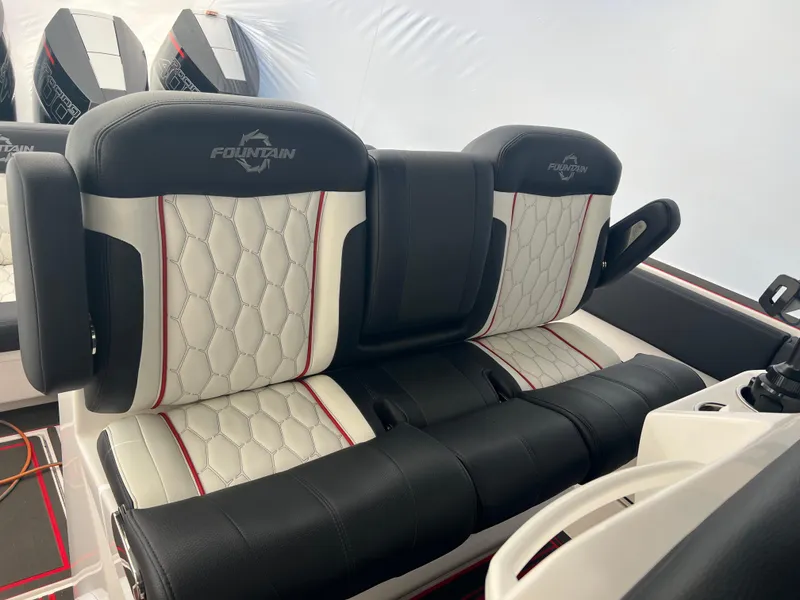 Slide: The Image of 2025 Fountain 38 SCX boat interior with luxurious black and white seating. - 28