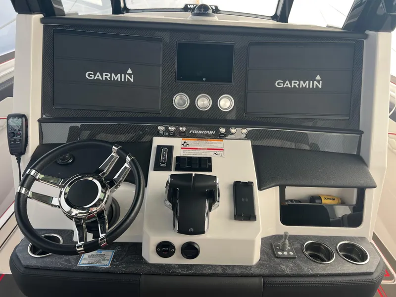 Slide: The Image of Control panel of 2025 Fountain 38 SCX boat with Garmin navigation displays. - 29
