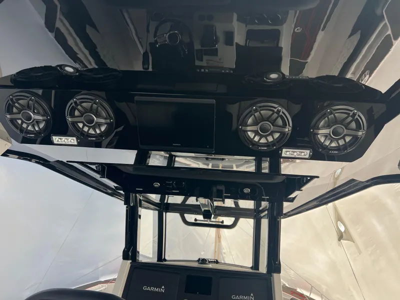 Slide: The Image of 2025 Fountain 38 SCX boat interior with advanced audio system and navigation displays. - 30