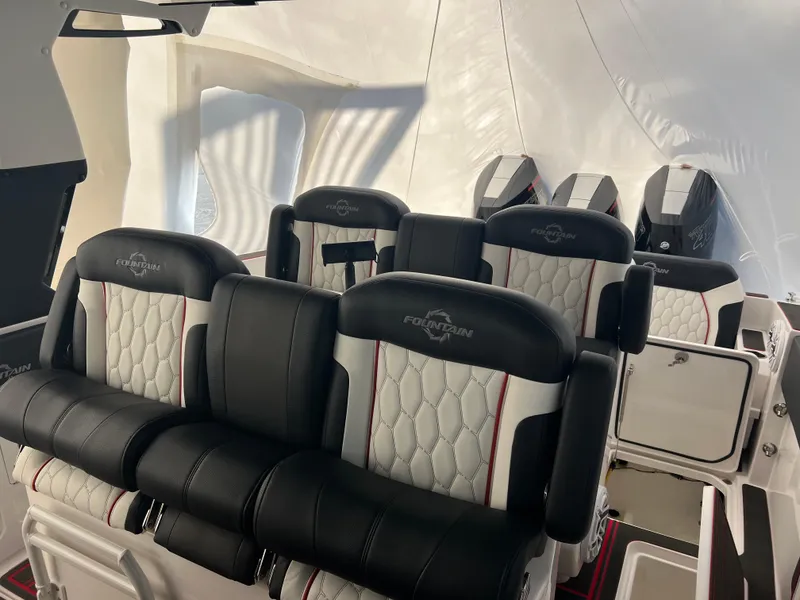 Slide: The Image of Luxurious seating inside 2025 Fountain 38 SCX boat, featuring premium black and white upholstery. - 32