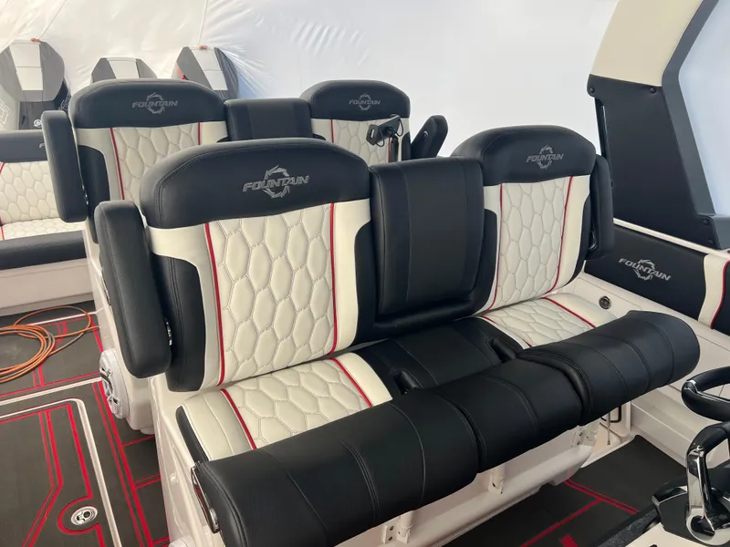 Slide: The Image of Luxurious seating in 2025 Fountain 38 SCX boat with black and white upholstery. - 33