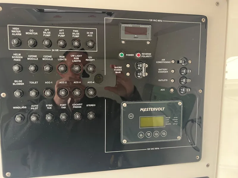 Slide: The Image of Control panel of 2025 Fountain 38 SCX boat with Mastervolt system and various switches. - 36