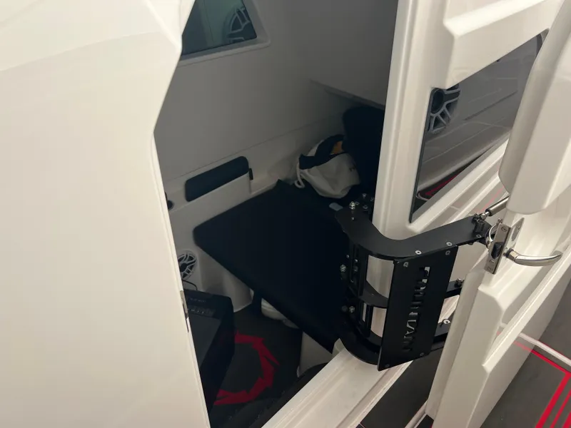 Slide: The Image of Interior cabin view of 2025 Fountain 38 SCX boat, featuring seating and storage. - 37