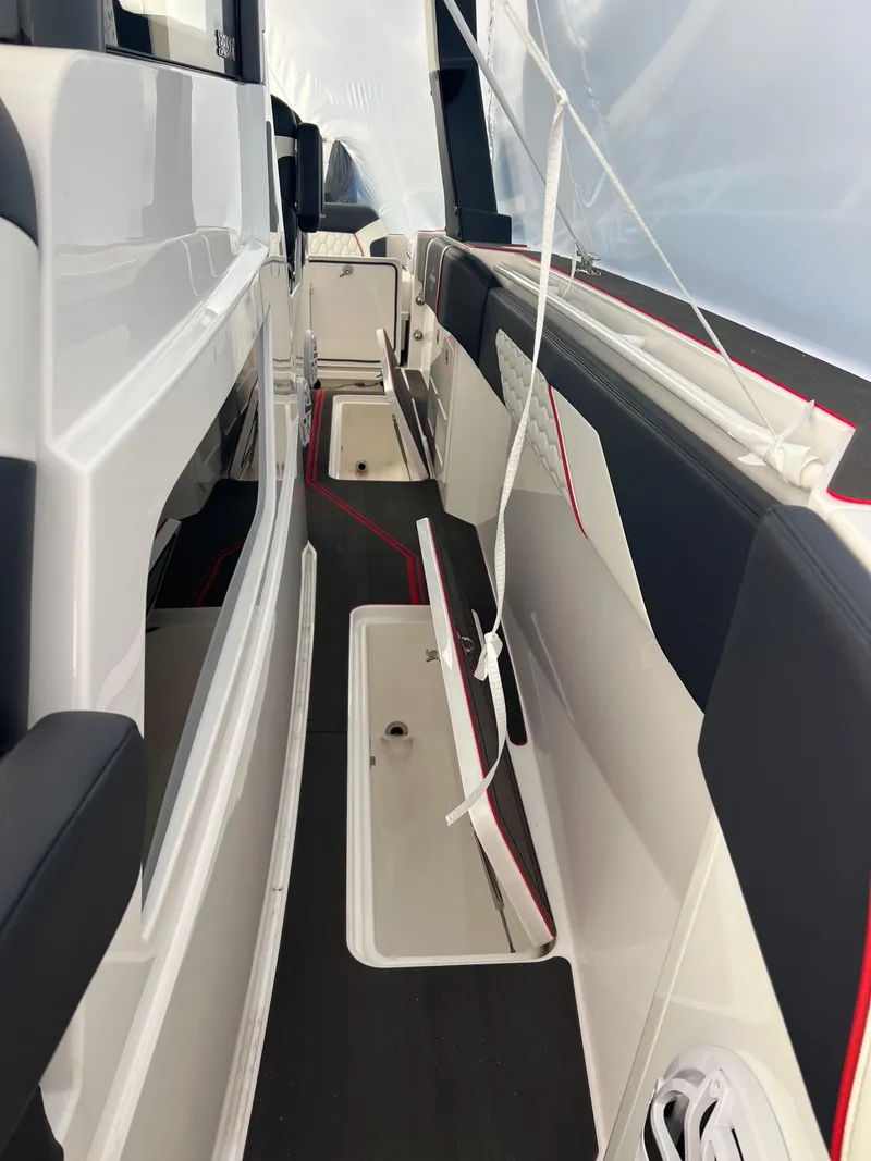 Slide: The Image of 2025 Fountain 38 SCX boat interior with sleek seating and storage compartments. - 44