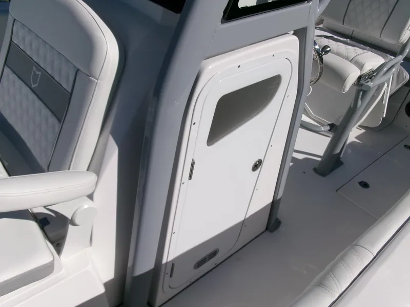 Slide: The Image of 2025 Sea Fox 268 Commander interior, featuring sleek seating and storage compartment. - 16