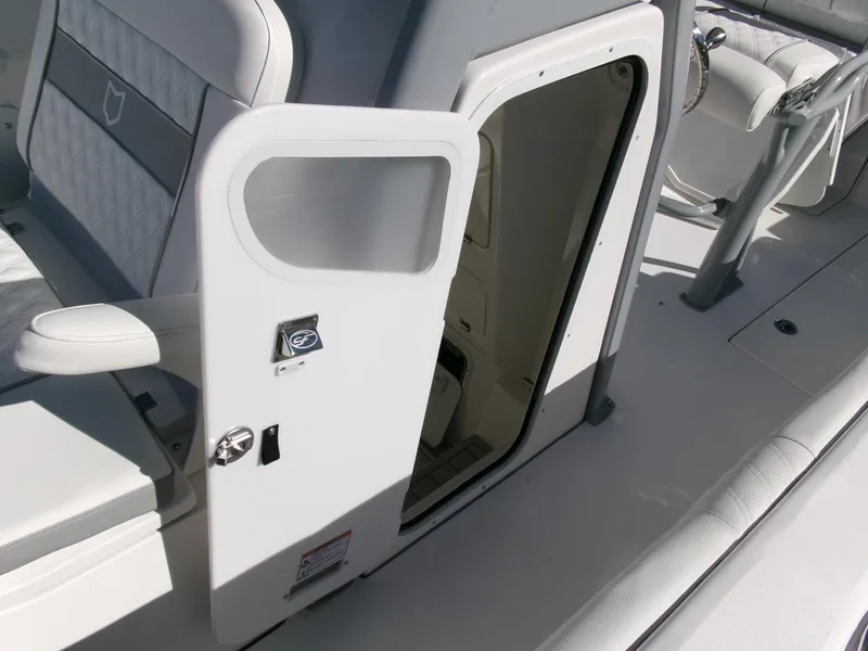 Slide: The Image of 2025 Sea Fox 268 Commander boat interior with open cabin door. - 17
