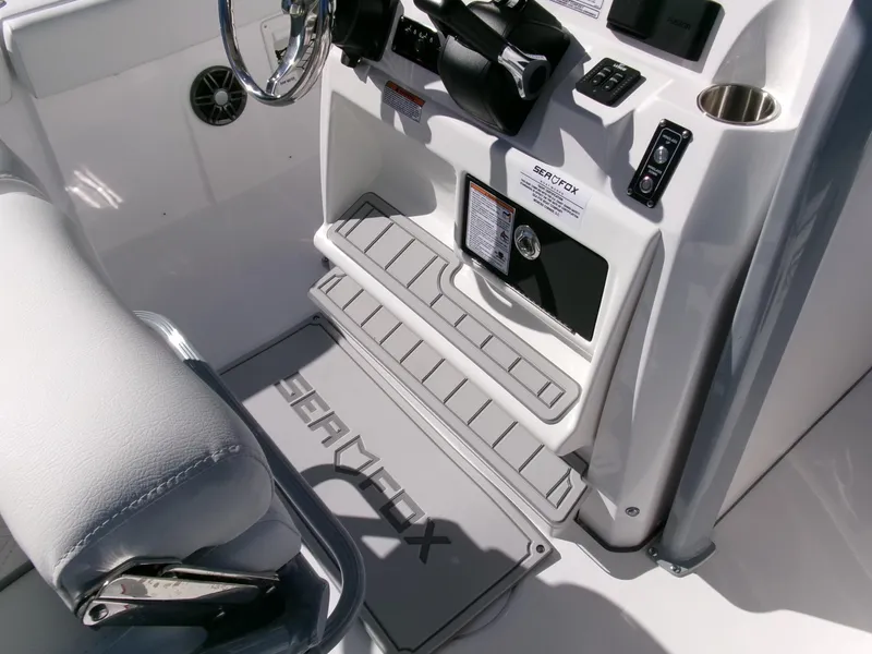 Slide: The Image of 2025 Sea Fox 268 Commander boat interior with steering console and seating. - 25