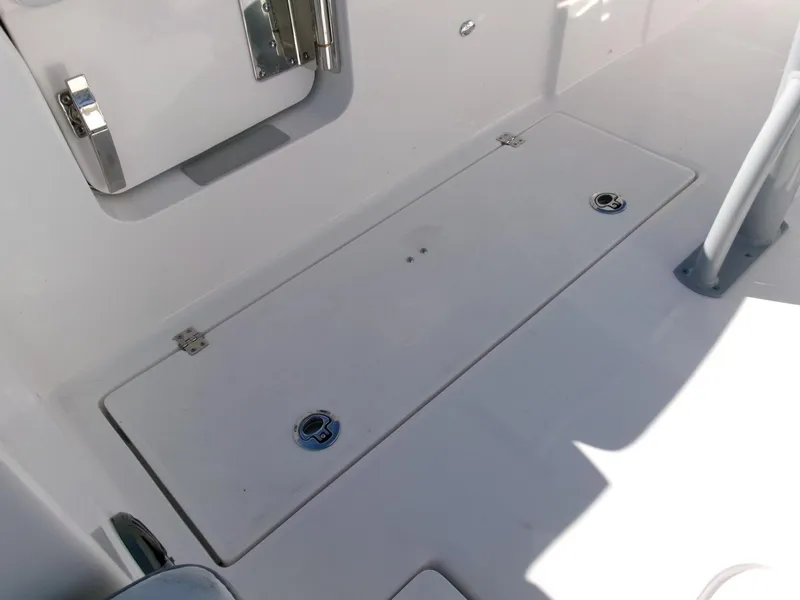 Slide: The Image of 2025 Sea Fox 268 Commander boat deck with storage compartment. - 28
