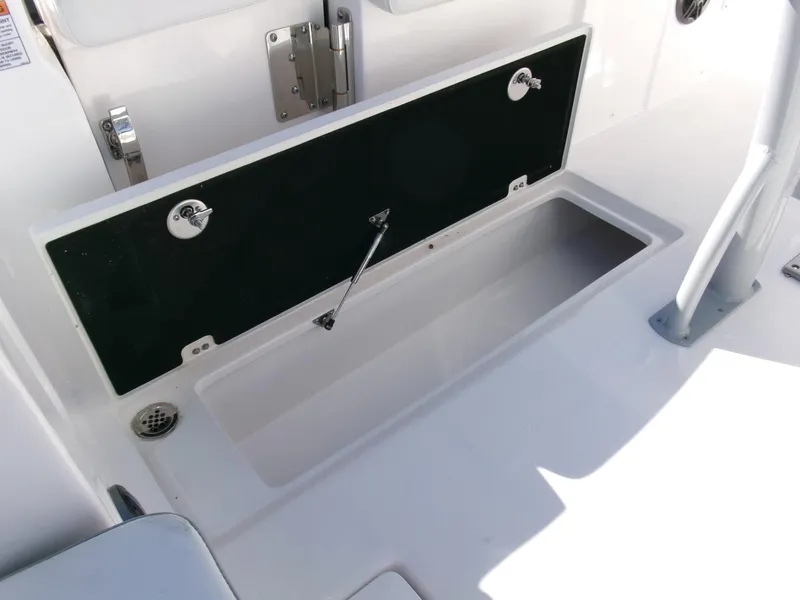 Slide: The Image of 2025 Sea Fox 268 Commander storage compartment, open and empty, showcasing interior space. - 29