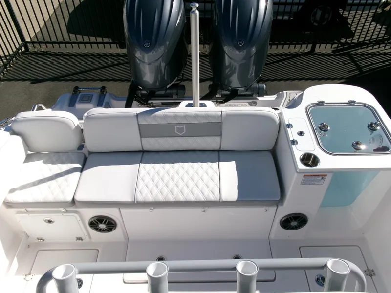 Slide: The Image of 2025 Sea Fox 268 Commander boat interior with cushioned seating and dual engines. - 32
